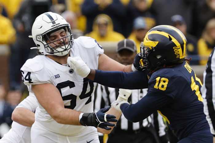 Oct 15, 2022; Ann Arbor, Michigan, USA; Penn State Nittany Lions offensive lineman Hunter Nourzad (64) blocks Michigan Wolverines linebacker Eyabi Okie (18) in the second half at Michigan Stadium. Mandatory Credit: Rick Osentoski-USA TODAY Sports  